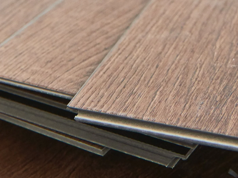 Children coloring and playing on luxury vinyl tile floor